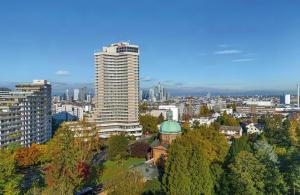a view of a city with a tall building at Leonardo Royal Hotel Frankfurt in Frankfurt