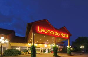 a leonardeco hotel with a neon sign on it at Leonardo Hotel Heidelberg Walldorf in Walldorf