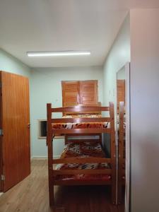 a room with two bunk beds in a room at Casa completa in Marechal Deodoro