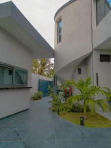 an external view of a building with a courtyard at Villa Amani in Somone