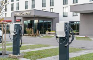 a row of pay phones in front of a building at Leonardo Hotel Bad Kreuznach in Bad Kreuznach