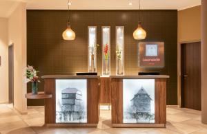 a display case in a lobby with a building at Leonardo Hotel Bad Kreuznach in Bad Kreuznach