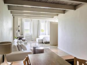 a living room with a couch and a bed at Hotel Boutique Bovedas de Santa Clara By Accor in Cartagena de Indias