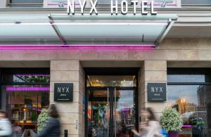a building with a sign that reads wx hotel at NYX Hotel Bilbao by Leonardo Hotels in Bilbao