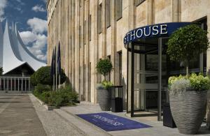 a building with a showcase sign in front of it at The Posthouse Berlin Potsdamer Platz- Leonardo Limited Edition in Berlin