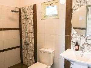a bathroom with a toilet and a sink at Mira Mirissa in Mirissa +71 photos