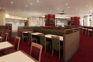 a rendering of a restaurant with tables and chairs at Hotel Monterey La Soeur Naha in Naha