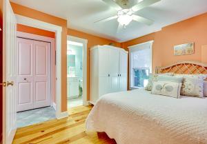 a bedroom with a bed and a ceiling fan at Happy Hours in Carolina Beach