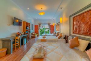 a large living room with a large bed in the middle at Angkor Rithy Residence in Siem Reap