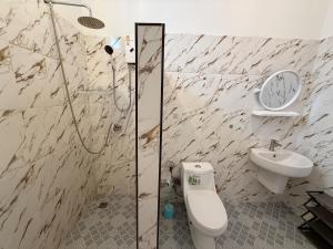 a bathroom with a shower and a toilet and a sink at Very Central Boho Home in Srithanu in Ko Kong Nui +64 photos