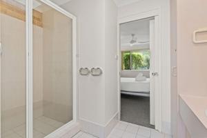 a white bathroom with a shower and a tub at Ballina Golf Unit in East Ballina +8 photos