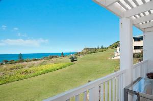 a view of the ocean from the balcony of a house at Quarterdeck 20 in Lennox Head