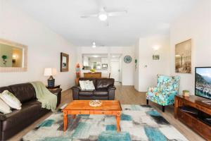 a living room with a couch and a coffee table at Quarterdeck 18 in Lennox Head