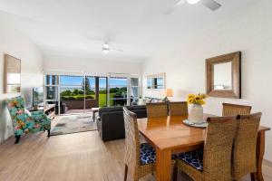a living room with a table and a couch at Quarterdeck 18 in Lennox Head