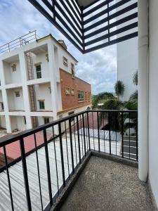a balcony with a view of a building at Korapura Resort in Nakhon Ratchasima