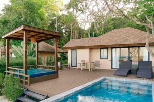 a deck with a gazebo and a swimming pool at Samed Amoris Resort & Pool Villas in Ko Samed