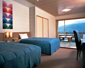 Postel nebo postele na pokoji v ubytování Akazawa Onsen Hotel + 37 fotografií