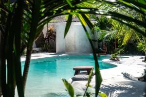 a small swimming pool with a stool in the middle at Mao Mao surf in General Luna +38 photos