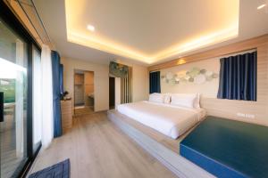 a hotel room with a bed and a bathroom at Samed Amoris Resort & Pool Villas in Ko Samed +103 photos