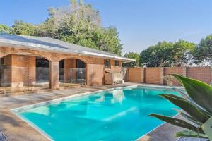 a swimming pool in the backyard of a house at Coorabell House in Ewingsdale +11 photos