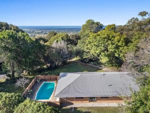 an aerial view of a house with a swimming pool at Coorabell House in Ewingsdale