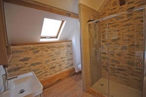 a bathroom with a shower and a sink at La pommeraie in Château-Chervix +32 photos