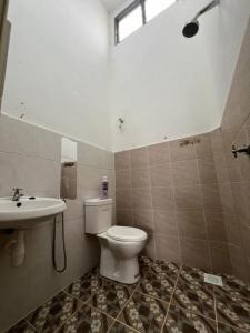 a bathroom with a toilet and a sink at LAMAN SUZY Seri Iskandar in Seri Iskandar +9 photos