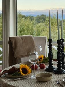 a table with a plate of food and two candles at Northern Lights View Cabin With Big Veranda in Ballangen +20 photos