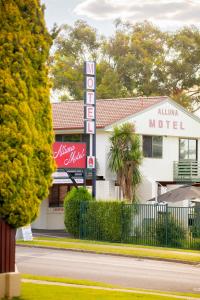 a motel with a sign in front of it at The Alluna Motel, an Ascend Collection Hotel in Armidale