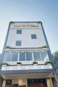 a building with a hotel mdi palace written on it at Hotel MDP Ayodhya Near Rammandir Ayodhya in Ayodhya