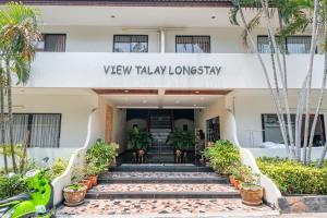 a building with a sign that reads view playlay lonsay at View Talay Longstay Hotel & Suites in Jomtien Beach +9 photos