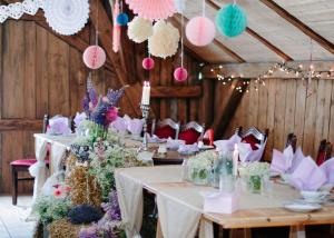 a room with long tables with flowers and candles at Waldgasthaus & Pension Teichhaus in Holzhau