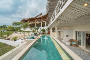 an indoor swimming pool in a house at Nusa View - Oceanfront Rentals in Nusa Lembongan