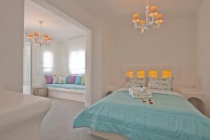 Postel nebo postele na pokoji v ubytování Aegean Queen Villas