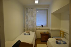 En eller flere senge i et værelse på Apartment Paasikivi