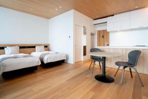 Llit o llits en una habitació de Cedars Hotel HAKUBA