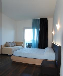 Postel nebo postele na pokoji v ubytování Medi Garden Hotel&Residence