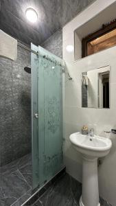 a bathroom with a sink and a glass shower at Altair Boutique in Samarkand +45 photos