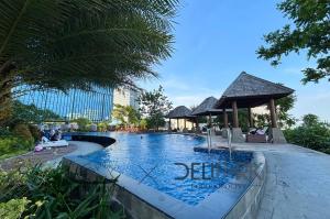 a swimming pool at a resort with a gazebo at SheepDream 7DI DeliparkMall 2Bedroom, 1Bathroom in Medan +66 photos