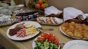a table topped with plates of food and appetizers at Hotel U Zlatého Lva in Havlíčkŭv Brod +19 photos