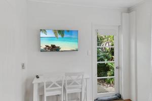 a white room with a view of the beach at Mudjimba Esp Villa-Beachfront-Pet friendly in Mudjimba