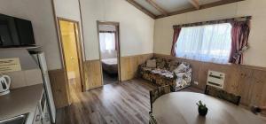 a living room with a couch and a table at Howlong Caravan Park in Howlong
