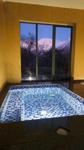 a swimming pool with a view of a mountain at The Himalayan Tyangboche in Thyāngboche