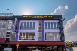 a hotel lavender inn on the corner of a street at Lavender Inn Nusa Bestari in Johor Bahru