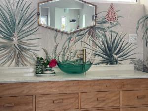 a bathroom counter with a sink and a mirror at McGregor Hideaways in McGregor