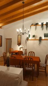 a dining room with a table and chairs at Cozy Chalet with Sea Views & Private Pool in Valldemossa