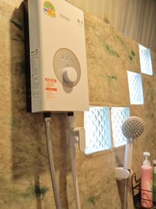 a box on top of a wall with a toothbrush at chananthida suyarach in Ban Mai Na Hi
