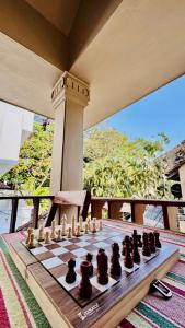a chess board sitting on top of a table at Scarlets Inn in Cochin
