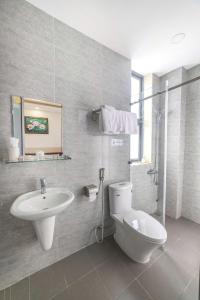 a bathroom with a toilet and a sink at Hamilton Villa Da Lat - Pine Tree n Valley View in Khu Chi Lăng +21 photos