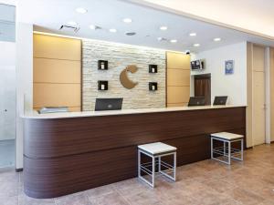 a lobby of a hospital with a reception counter at Comfort Hotel Yamagata in Yamagata